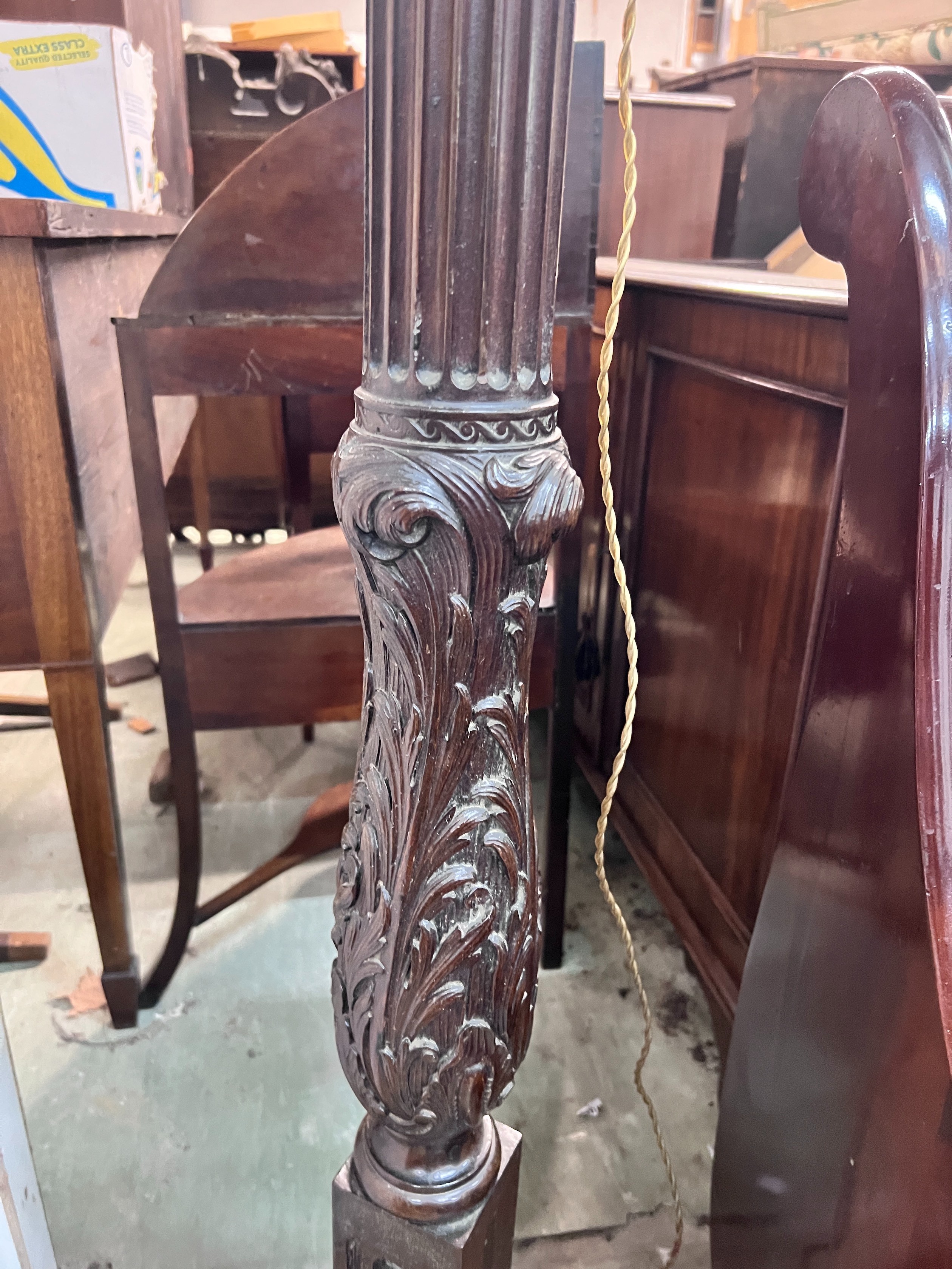 A carved oak and mahogany carved standard lamp, height 151cm *Please note the sale commences at 9am.